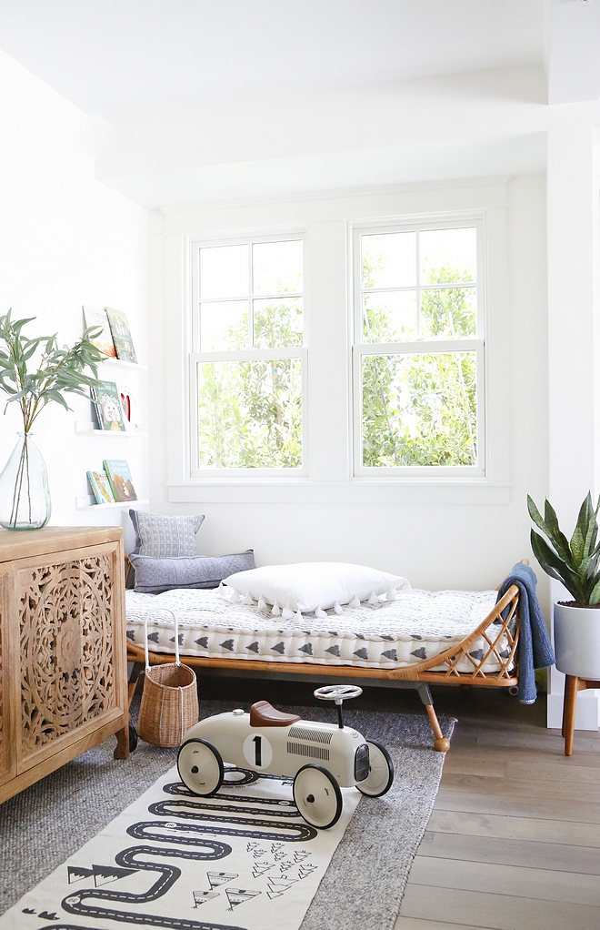 Living Room We created a small area for the kids to play and read in which includes a daybed and buffet console to store toys #livingroom #kidsarea #toystorage #storageideas