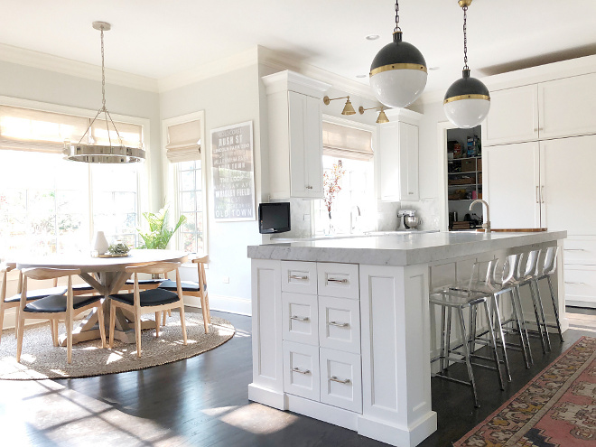 Kitchen and Breakfast Nook Design Ideas Beautiful white kitchen and breakfast room with round table mid-century dining chairs and a ring chandelier Kitchen and Breakfast Nook Design Ideas #kitchen #breakfastnook #beautifulkitchen