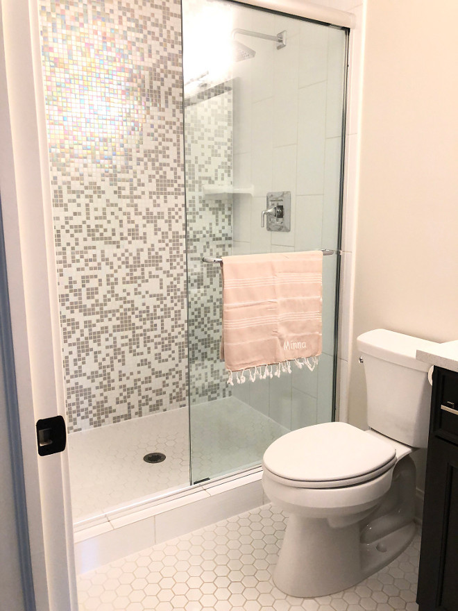 Teen Girl Bathroom Design Teenage bath with iridescent tile Bathroom features white hex floor tile and iridescent shower tile #teenbathroomdesign #iridescenttile