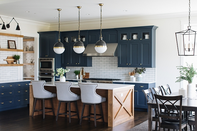 Kitchen upper cabinet decor Do you ever wonder what to place on the top cabinets In this kitchen the designer placed a single white pitcher in each glass cabinet This draws your eye to it plus it's great storage for items not used all the time #kitchendecor