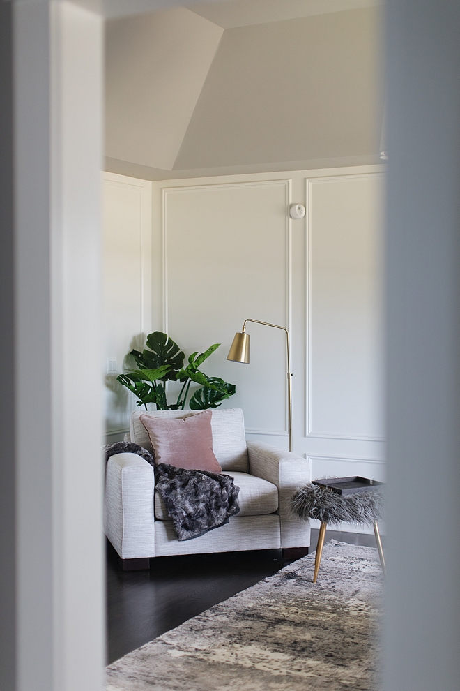 Bedroom sitting area with a comfortable chair and magnolian lamb stool #bedroom #sittingarea