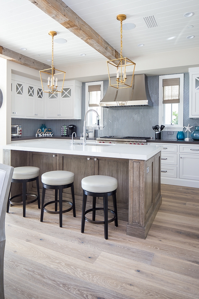 Farmhouse kitchen with exposed reclaimed beams wide plank hardwood flooring White Oak kitchen island and herringbone backsplash Kitchen farmhouse kitchen kitchens #Farmhousekitchen #kitchen #exposedbeams #reclaimedbeams #wideplankhardwoodflooring #hardwoodflooring White Oak kitchen island and herringbone backsplash