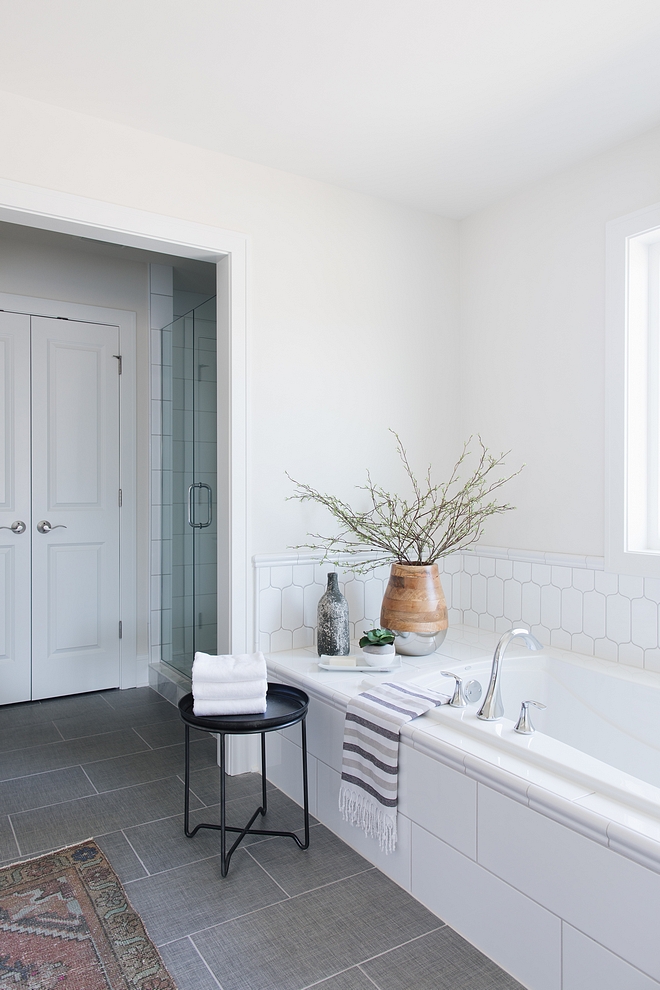 In the bathroom we used a tile from The Tile Shop called “Caption” around the tub deck It compliments the subway tile but adds some visual interest #bathroom #tile #tubdeck