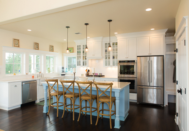 White kitchen with light tan walls and blue island Perimeter cabinets are painted in Sherwin Williams Extra White SW7006 Blue kitchen island paint color Sherwin Williams SW9061 Rest Assured #whitekitchen #bluekitchenisland