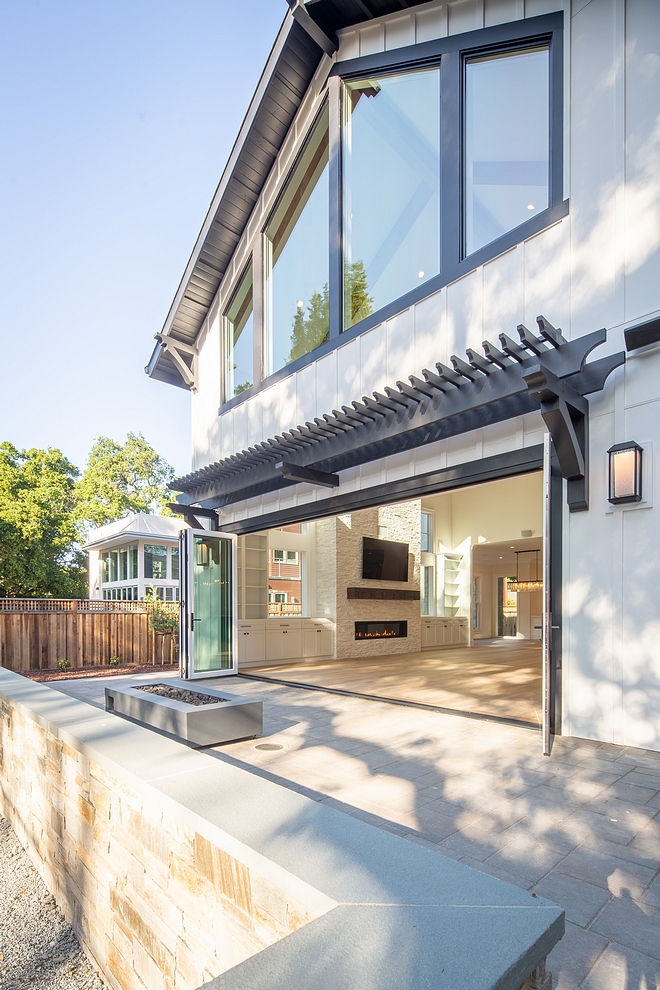 Modern Farmhouse architectural details of this modern farmhouse, including the board and batten siding, the black trim and the black windows and doors Modern Farmhouse architectural details #ModernFarmhouse #architecturaldetails #boardandbatten #blacktrim #blackwindows #blackdoors