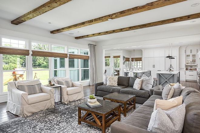 Reclaimed Wood beams in Living room with windows with natural Roman shades to keep the same organic natural feel Reclaimed Wood beams #ReclaimedWoodbeams #Reclaimedbeams