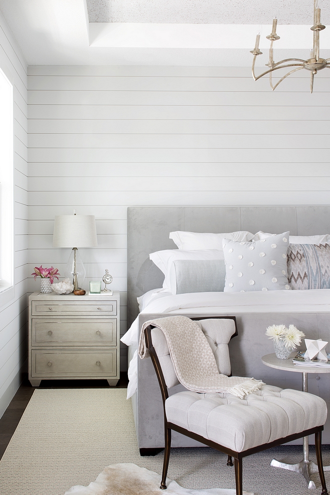 The master bedroom also features shiplap paneling painted in Decorator's White by Benjamin Moore #bedroom #masterbedroom #paintcolors #benjaminmoorepaintcolors #whitepaintcolor #DecoratorsWhiteBenjaminMoore