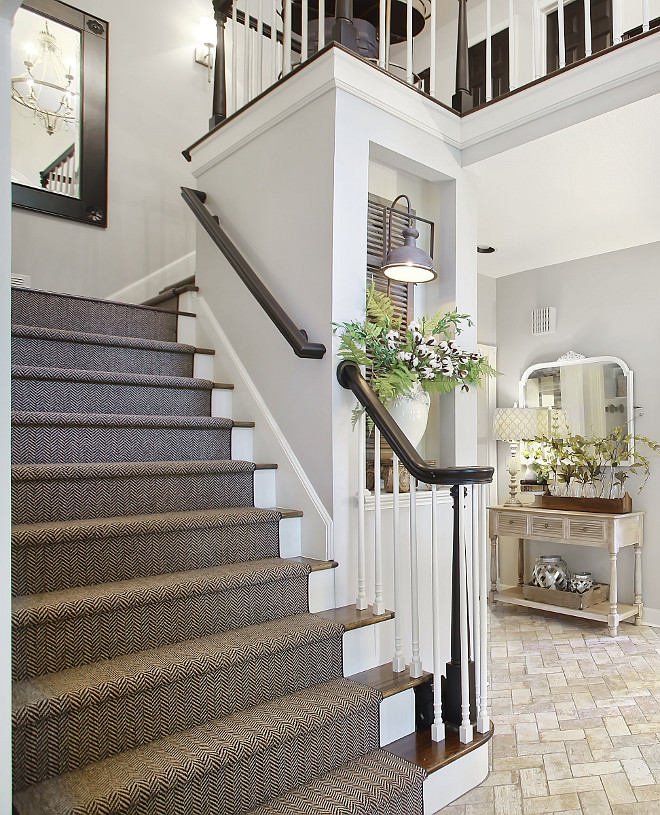 Staircase reno ideas Stair railing and post are painted in Sherwin Williams Tricorn Black Herringbone Stair Runner #staircasereno #Stairrailing #railingpaintcolor #SherwinWilliamsTricornBlack #HerringboneStairRunner #StairRunner