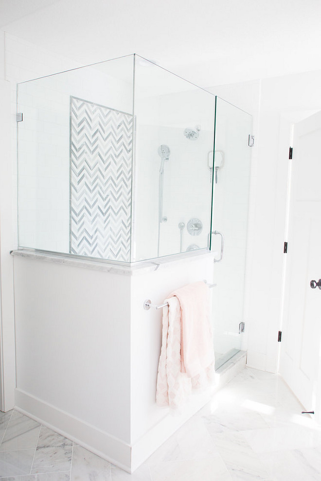 Master Bathroom Shower Ideas shower features white subway tile with a marble chevron accent tile Flooring is white marble tile Master Bathroom Shower Ideas #MasterBathroom #MasterBathroomshower #ShowerIdeas