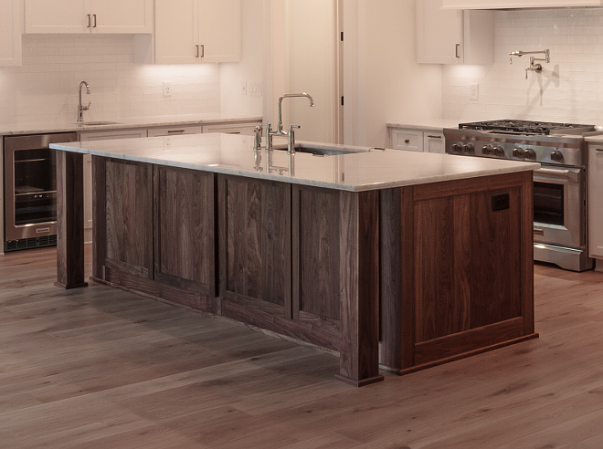 Walnut island with white marble countertop Kitchen island is Walnut (wood) in natural finish Kitchen island is Walnut (wood) in natural finish Beautiful kitchen combination of white perimeter cabinets with Walnut island #walnutisland 