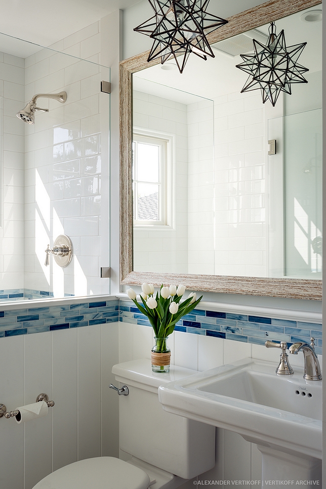 Small Bathroom This shows that a small bathroom can look not only beautiful, but also bright and welcoming The bathroom features a combination of large white subway tile (4x12) and Blue Recycled Glass Accent Tile Small Bathroom Small Bathroom #SmallBathroom #Bathroom #bathroomtile