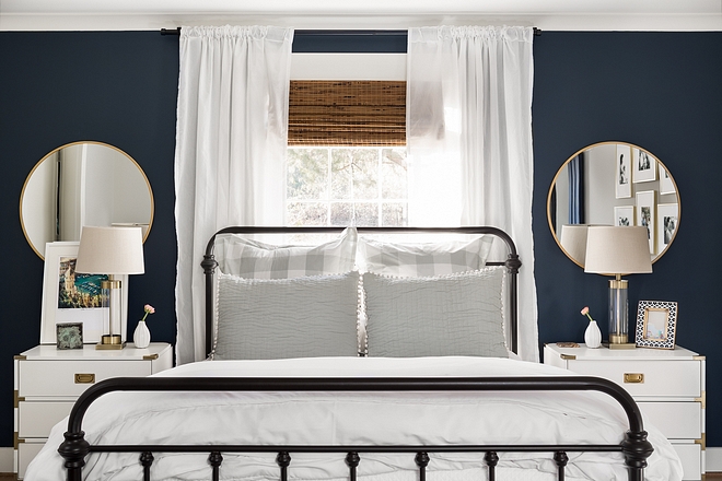 Farmhouse bedroom with metal bed Farmhouse bedroom with metal bed and round brass mirrors above white nightstands #Farmhousebedroom #metalbed