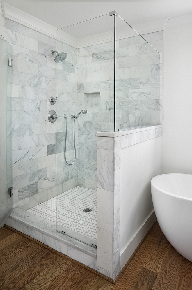 Shower Tile Shower walls 6x12 Arabescato Carerra Honed. Sterling Grout. Shower floor tile is Primate White/Gray Basketweave tile. Shower floor border 6x12 Arabescato Carrara Honed custom cut to make border #shower #tile