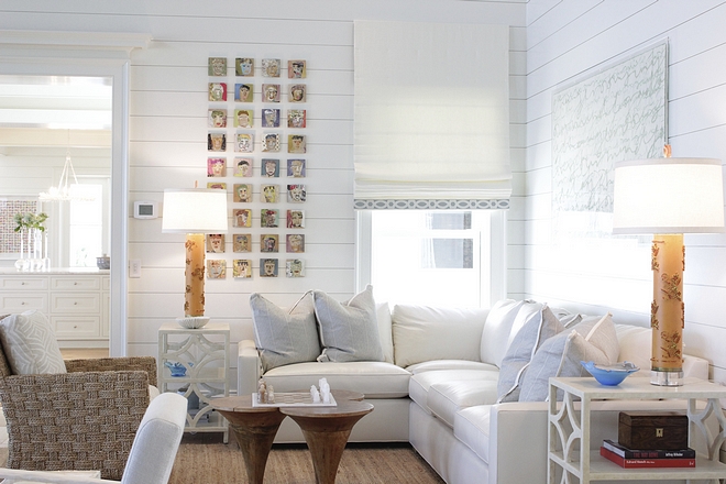 Coastal living room with corner sectional and walls clad in shiplap