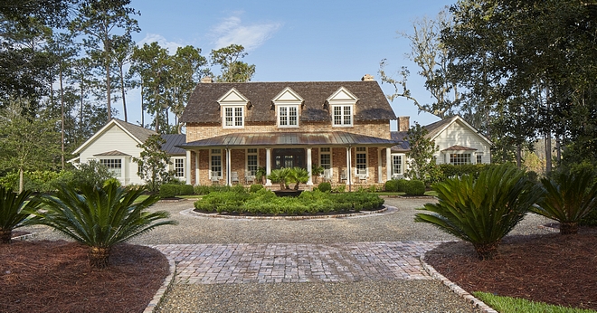 The house incorporates many natural and reclaimed materials The symmetrical main body of the house is a 1.5 story element with historical dormers bringing light into the upstairs bedrooms Reclaimed brick and a buff mortar give a statement of authenticity #architecture