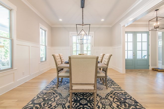 Dining room grey wall above wainscoting painted in Sherwin Williams Passive