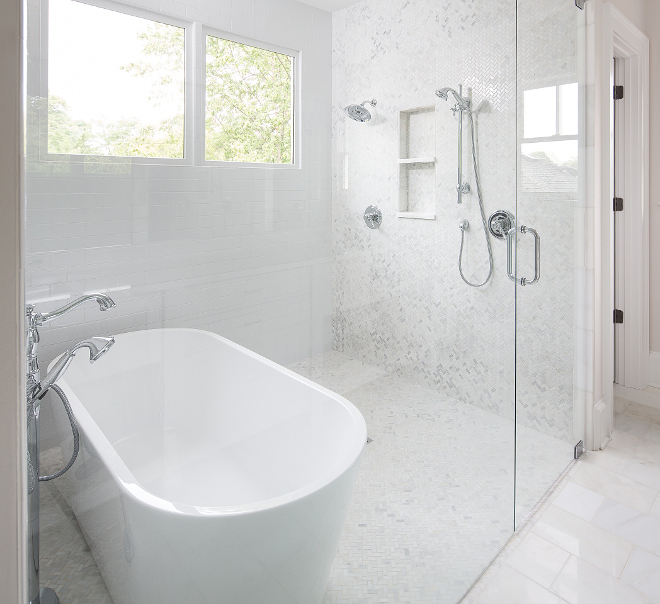 Shower with freestanding tub The master bathroom features a marble wet area with tub and shower to create a streamlined feel to the space #shower #largeshower #showerwithfreestandingbath
