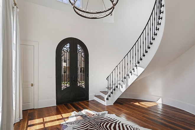 Iron Staircase with Iron Front Door Foyer The iron staircase railings was custom fabricated #IronStaircase #IronFrontDoor #Foyer #ironrailing #railing