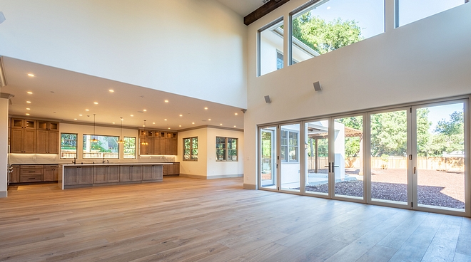 A wide view of the kitchen, breakfast nook and Great Room, which opens to the expansive backyard