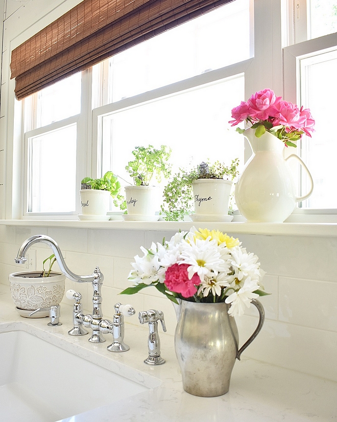 White kitchne with classic white subway tile and marble looking quartz countertop Affordable and timeless kitchen #Whitekitchne #classicwhitesubwaytile #whitesubwaytile #quartz #countertop