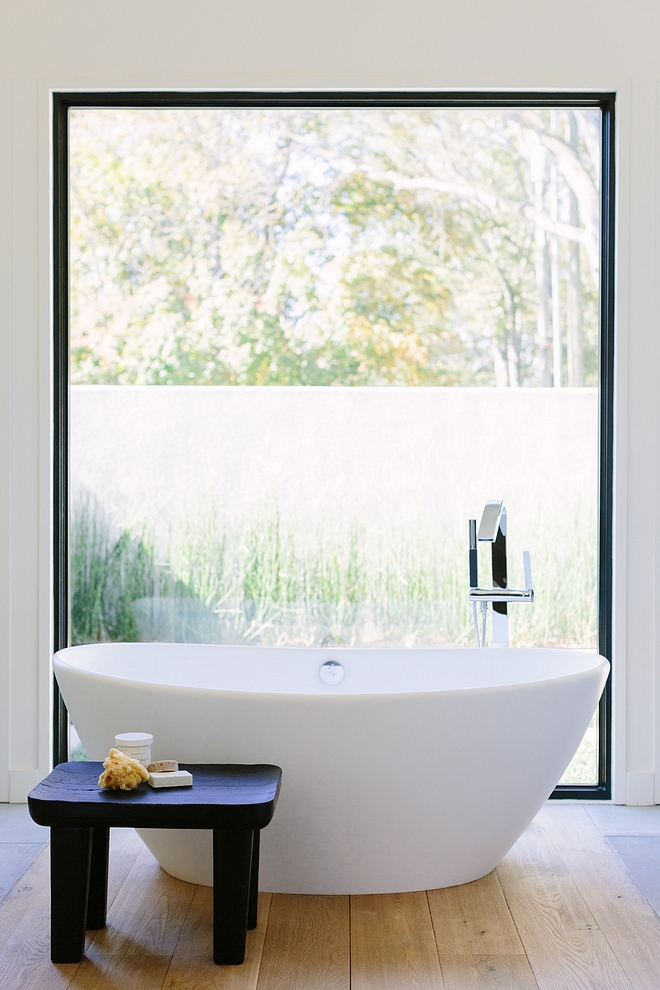 Freestanding tub stool Bathroom with large black steel window, Freestanding tub and a custom black stool Bathroom Freestanding tub stool Freestanding tub stool #Freestandingtub #stool #bathroomwindow