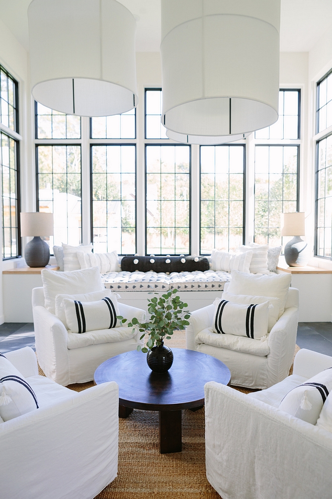 Chair sitting are The four chairs in the center of the room and the huge fabric pendants make the room feel cozy enough for intimate gatherings #chairs #sittingarea
