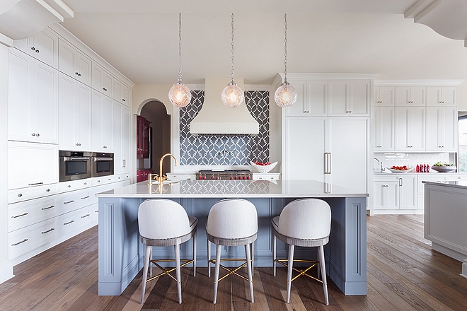 Kitchen The kitchen features custom cabinetry Perimeter and island features Quartzite with bevel square edge countertops #kitchen