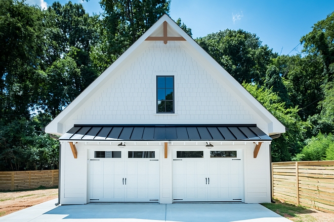 Detached garage Carriage Home Design Beautiful and detailed, from the metal roof overhang, to the cedar brackets, to the doors themselves #Detachedgarage #CarriageHome