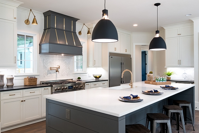 Modern Farmhouse Kitchen Would a modern farmhouse kitchen be completed without a shiplap island? We didn't think so. We choose the white quartz counter top on the island and white surround cabinets, but went with a grey island base and dark surround countertops #modernfarmhousekitchen #kitchen