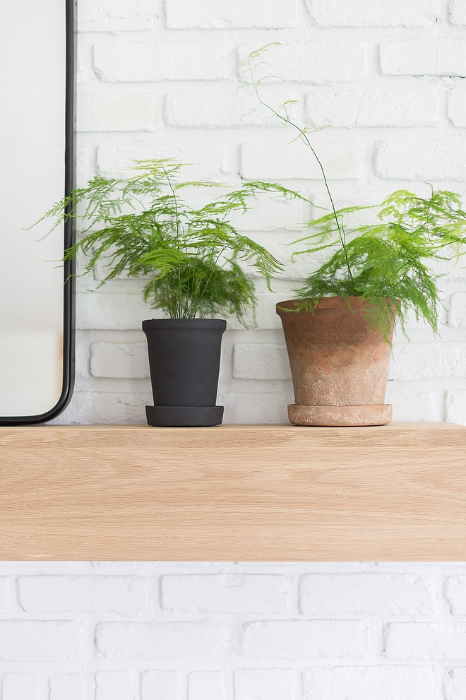 White Oak Mantel Fireplace Mantel The White Oak mantel was custom-designed by the homeowner and it looks great against the painted brick 2540 Love ©AlyssaRosenheck #whiteoakmantel #mantel #fireplacemantel