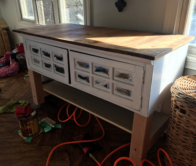 DIY Island We repurposed the old black entertainment center we had into this rolling folding table All details explained on Home Bunch Blog