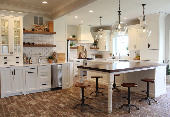 Farmhouse White Kitchen Farmhouse White Kitchen with l-L-shaped kitchen island and brick flooring #FarmhouseWhiteKitchen #FarmhouseKitchen #WhiteKitchen
