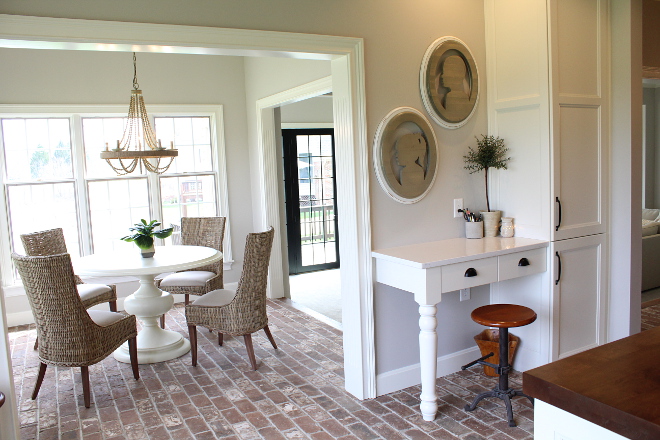 Kitchen Desk wall paint color is Worldly Gray SW 7043 Sherwin Williams Flooring is real brick #kitchen #desk #WorldlyGraySherwinWilliams