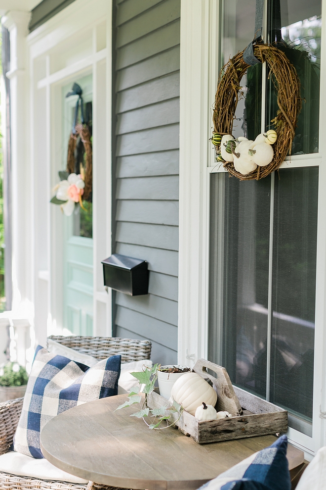 Front porch with porch table with Fall Decor white pumpkins and Fall wreaths #porch #frontporch #Fallwreath #whitepumpkin #falldecor