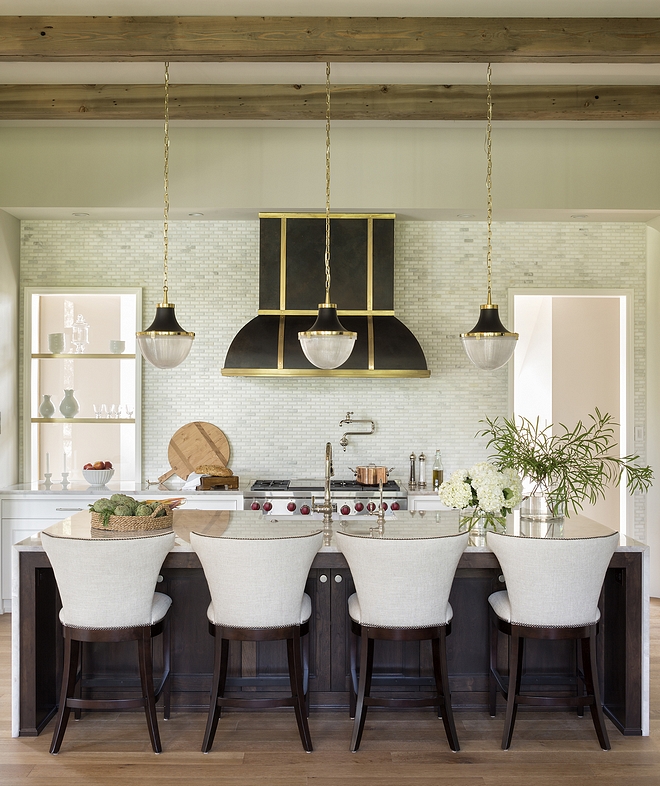 Kitchen This extraordinary kitchen features a custom range hood and open shelving in aged brass and zinc finishes Kitchen island is made of Walnut #Kitchen #Walnutisland #Kitchendesign