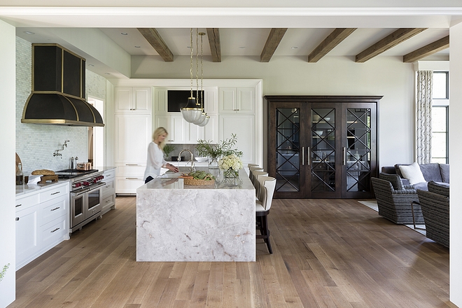 Kitchen A custom buffet is flanked by paneled refrigerator and freezer by Subzero Notice the built-in concealing a tv in the hutch #kitchen #buffet #tvkitchen #kitchentv