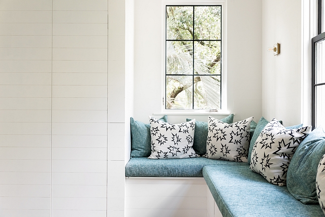 The playroom features a custom Banquette in Kelly Wearstler fabric with pillows in Kate Loudon Shands “POW” fabric #playroom #fabric #KellyWearstlerfabric