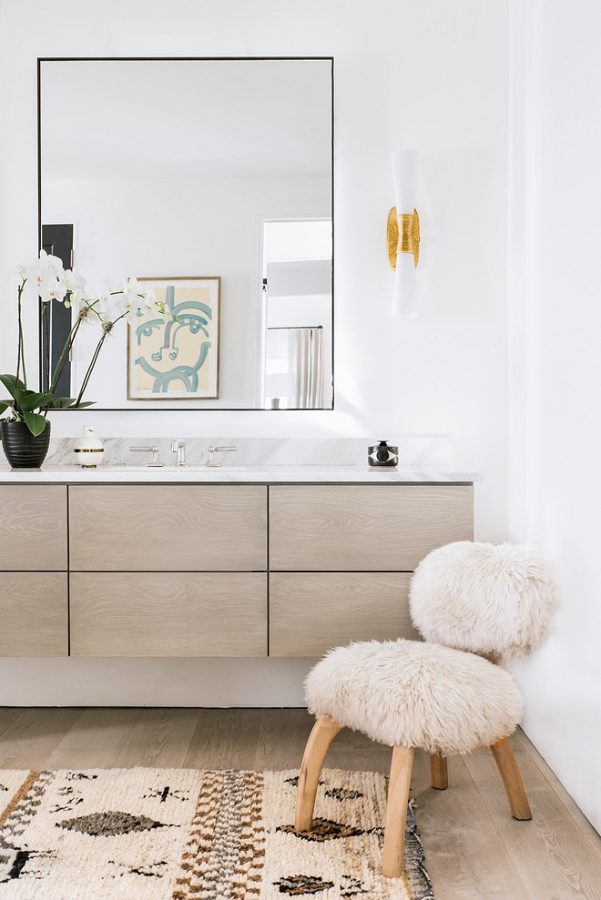 Master bathroom showcases floating cabinetry to match the French Oak floors, Borghini marble countertop #floatingvanity #bathroomvanity #FrenchOak