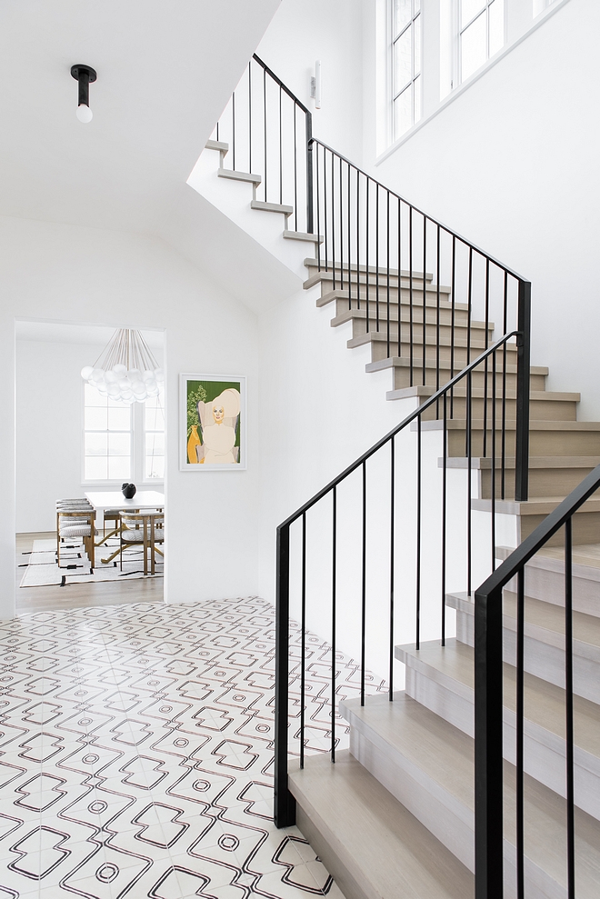 Foyer with White Oak Staircase, Metal Railing and Navajo Zebra Cement Tile #Foyer #WhiteOak #Staircase #MetalRailing #NavajoZebraCementTile #CementTile