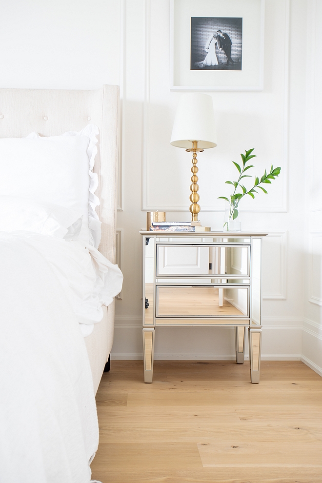 Mirrored Nightstand Timeless way to decorate a bedroom Wainscoting Tufted bed White bedding Mirrored Nightstand and White Oak hardwood flooring Mirrored Nightstand #MirroredNightstand #bedroom #decor #bedroomdecor