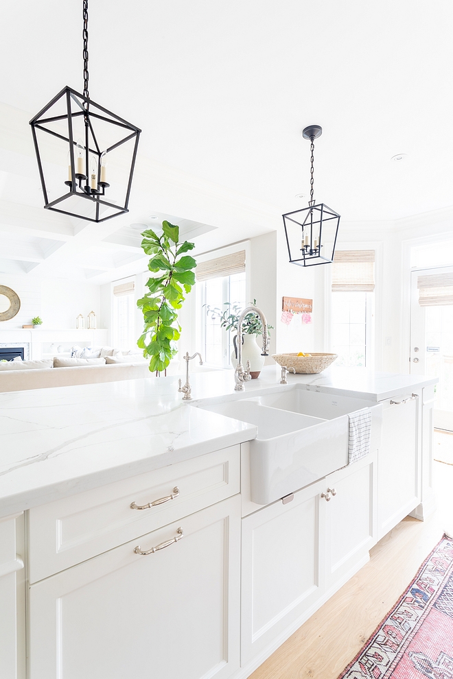 White Kitchen Island Paint Color Benjamin Moore Simply White with Double Basin Farmhouse Kitchen Sink and Calacatta Quartz Countertop #kitchenisland #whitekitchenisland #DoubleBasinFarmhouseSink #BenjaminMooreSimplyWhite