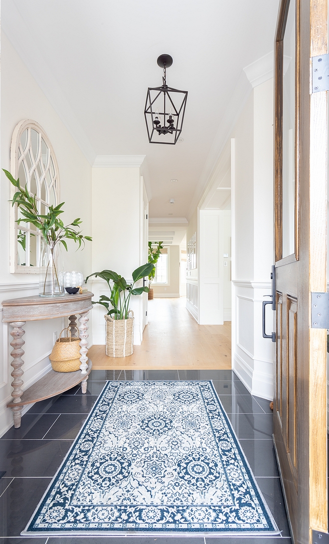 Foyer Tiling Ideas Foyer Tile Combination of tile and continuation with hardwood flooring on the remaining spaces Tile in foyer #FoyerTile #Foyer #Tile #foyertiling