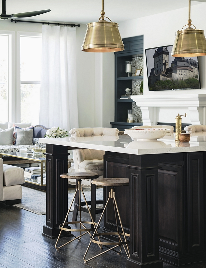 Espresso Stained kitchen island with white marble countertop Classic kitchen island with custom espresso stain color and polished white marble countertop Lighting and counterstool sources on Home Bunch #kitchenisland #darkkitchenisland