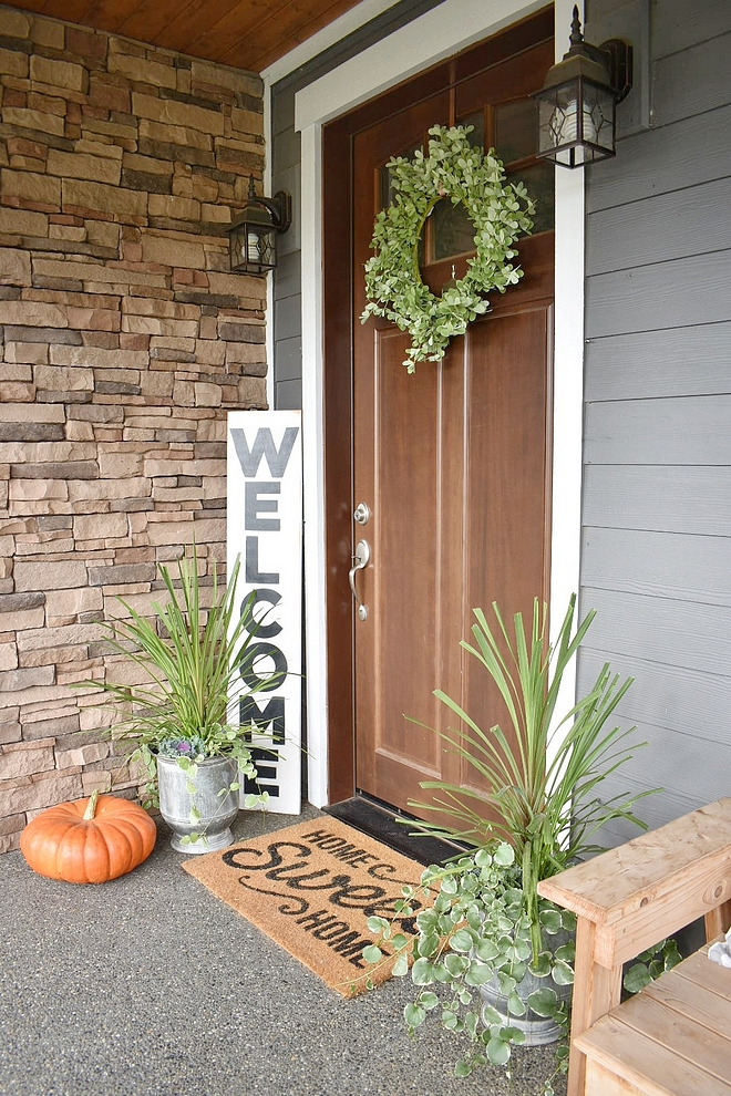 Fall Decor We actually had these same flower pots flanking our front door this summer, but to add a fall touch I added a small cabbage plant into the pot as well