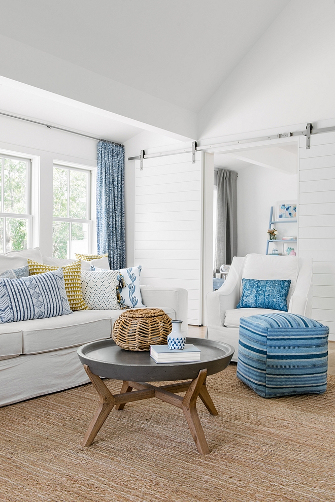 Shiplap Barn Door White Shiplap Barn Doors Living room with White Shiplap Barn Doors dividing the space from a kids playroom #WhiteShiplapBarnDoors #ShiplapBarnDoor