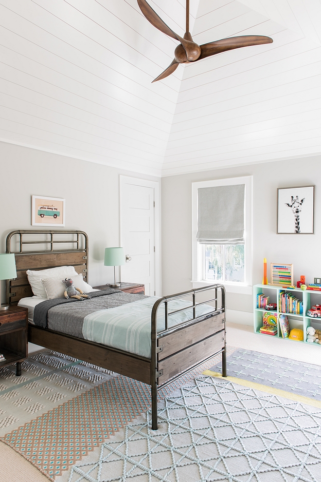 Benjamin Moore Rodeo This boys bedroom features a fresh and happy color palette. Also notice the vaulted ceiling with shiplap Bedroom paint color Benjamin Moore Rodeo #BenjaminMooreRodeo #boysbedroom #shiplap #vaultedceiling