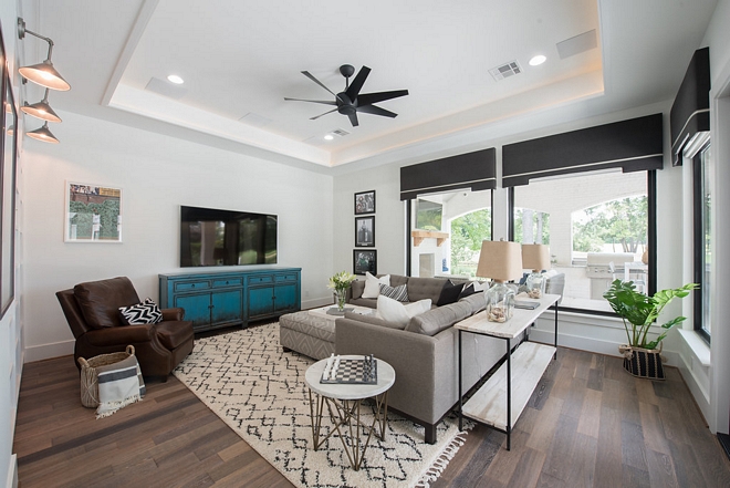 Family Room The family room opens directly to the pool and area This space is perfect to watch TV and spend some casual time with family and friends #familyroom