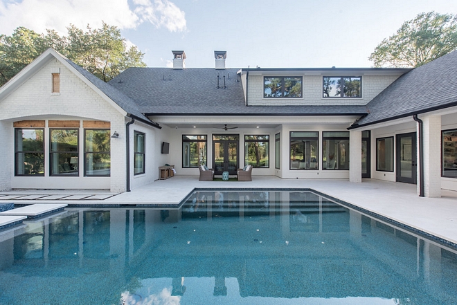 Modern Farmhouse Pool New Pool Design Modern Farmhouse Perfect combination of architectural details are carried from the home to the pool design #ModernFarmhousePool #ModernFarmhouse #Pool #newpool #newpooldesign