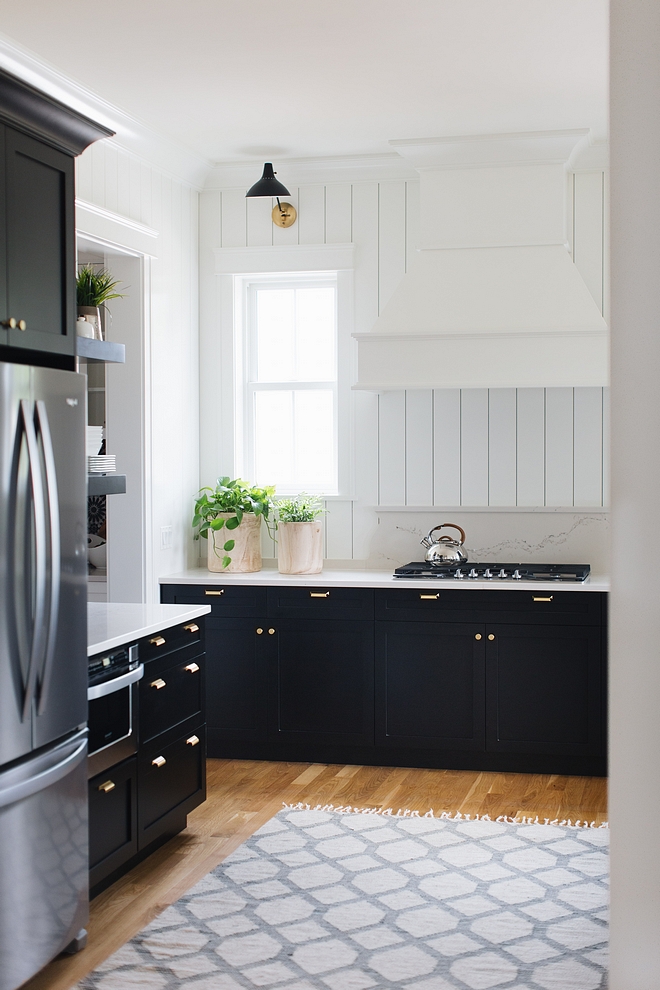 Shaker-style kitchen cabinet painted in BM Black with vertical white shiplap as backsplash Shaker-style kitchen cabinet Black Shaker-style kitchen cabinet #Shakerstylekitchencabinet #Shakerstylecabinet #Shakercabinet