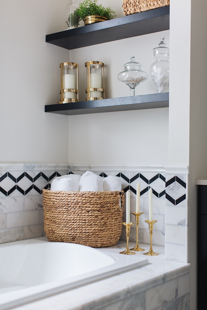 Bath nook tiling The tiling is a combination of Carrara marble tile with black accent tile #bathnook #tile